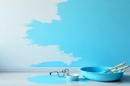 DIY paint finish streaky causes shown on wall with paint roller and tools demonstrating common painting problems and solutions