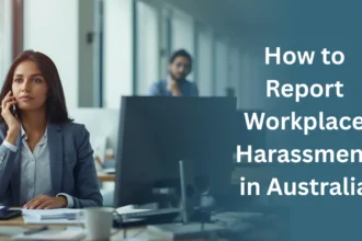 Professional woman in an office speaking on the phone, with headline text “How to Report Workplace Harassment in Australia” displayed on the right.