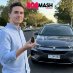 Driver holding car keys next to a friend’s car in Australia, illustrating the concept of borrowed vehicle insurance coverage.